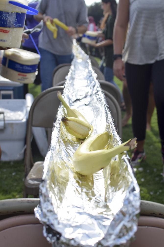 LSU students enjoy a 100-foot-long banana split on Monday, Aug. 21, 2017, on the Parade Grounds.