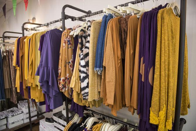 Edge Boutique displays a variety of purple and gold shirts and blouses on Monday Nov. 14, 2016, on Highland Road.