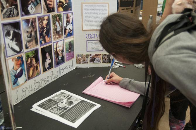 LSU biology sophomore Kristi Bell signs up for Animal Care for a Cause at the Student Involvement Fair at the LSU student union building on Thursday, Aug. 31, 2017.