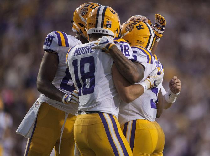 LSU football players celebrate during LSU's 45-10 win against Chattanooga on Saturday, Sept. 9, 2017, at Tiger Stadium.