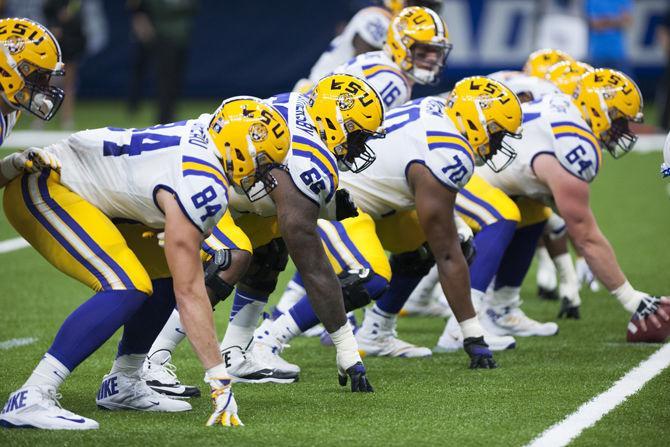 LSU's offensive line sets up before the play on Saturday, Sep. 2, 2017, during the Tigers' 27-0 win against the BYU Cougars in the Mercedes-Benz Superdome in New Orleans, Louisiana.