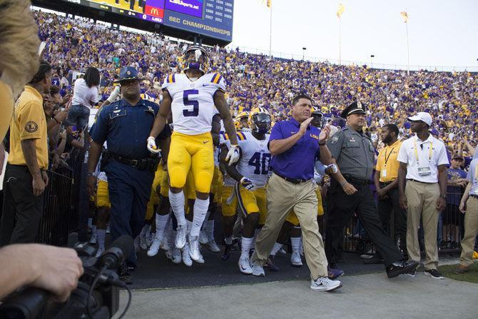 Head coach Ed Orgeron and team walking onto the feild from the locker room before the Tigers 45-10 victory over Chattanooga on Saturday, Sept. 9, 2017 in Tiger Stadium.