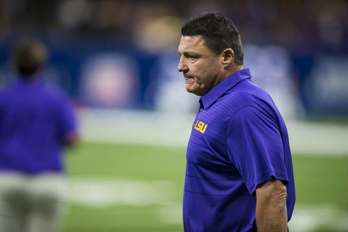 LSU head football coach Ed Orgeron watches as the Tigers warmup before LSU's 27-0 win against BYU on Saturday, Sept. 2, 2017, at the Mercedes-Benz Superdome in New Orleans.