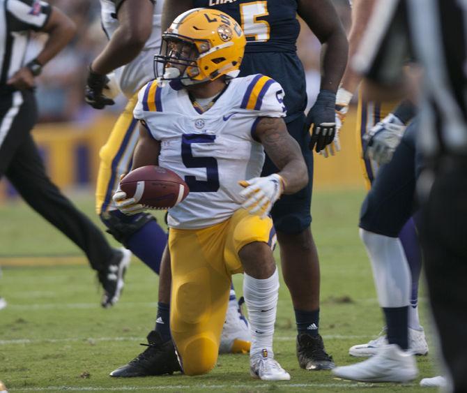 LSU junior running back Derrius Guice (5) kneels during LSU's 45-10 win against Chattanooga on Saturday, Sept. 9, 2017, at Tiger Stadium.