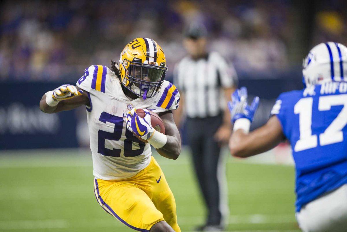 LSU senior running back Darrel Williams (28) rushes the BYU end-zone as BYU senior defensive back Marvin Hifo (17) approaches to block during LSU's 27-0 win against BYU on Saturday, Sept. 2, 2017, at the Mercedes-Benz Superdome in New Orleans.