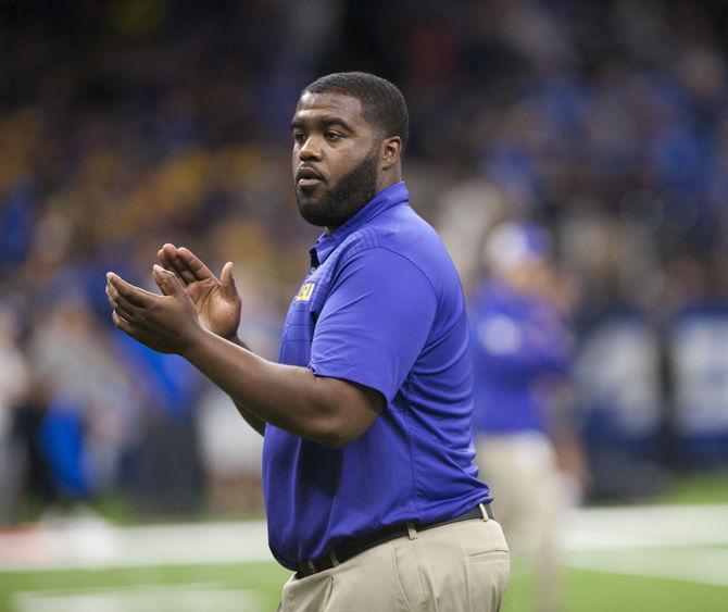 LSU outside linebackers coach Dennis Johnson coaches his team on Saturday, Sep. 2, 2017, during the Tigers' 27-0 win against the BYU Cougars in the Mercedes-Benz Superdome in New Orleans, Louisiana.