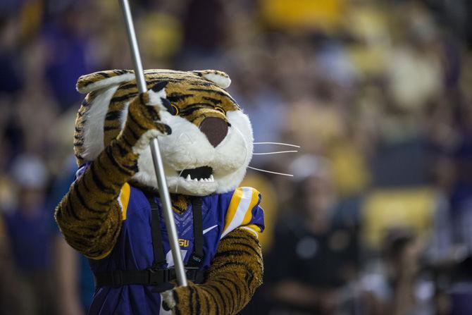 Mike the Tiger runs down the end-zone with an LSU flag after a touchdown during the LSU 45-10 win against Southern Mississippi on Saturday Oct. 15, 2016, in Tiger Stadium.