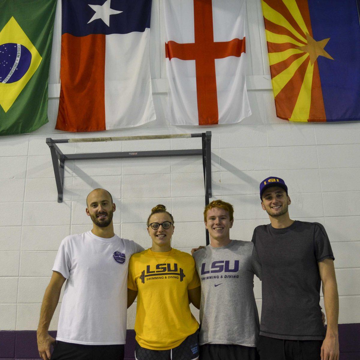 (From left to right) LSU assistant coach Steve Mellor, freshman swimmer Ellie Baldwin, sophomore swimmer Lewis Clough and senior swimmer Harry Ackland take a break after practice on Friday, Sept. 15, 2017, at the LSU Natatorium on Lakeshore Drive.