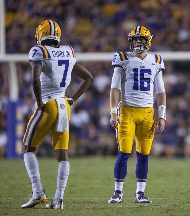 LSU senior quarterback Danny Etling (16) and senior wide receiver DJ Chark (7) await the next quarter during LSU's 45-10 win against Chattanooga on Saturday, Sept. 9, 2017, at Tiger Stadium