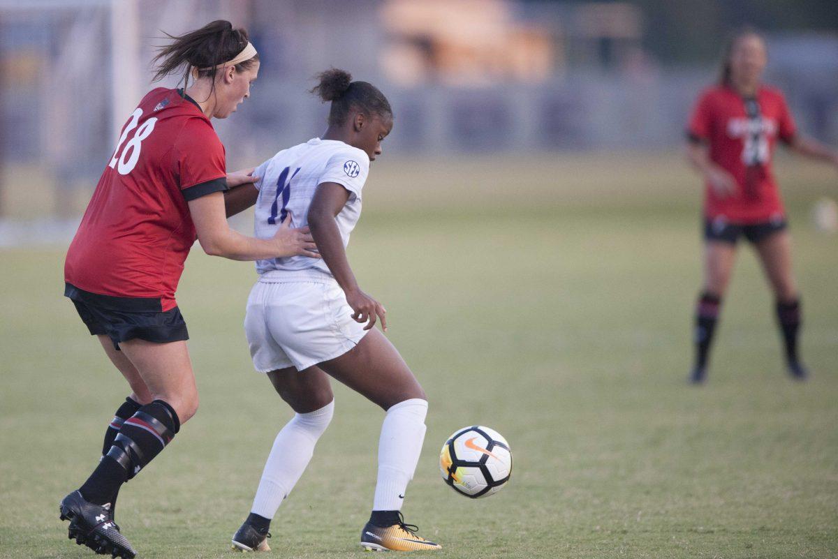 LSU freshman forward Tinaya Alexander (11) blocks the ball from Cincinnati defense Taylor Pavlika (28) in LSU's 1-0 win against Cincinnati at the LSU Soccer Complex on Sept. 14, 2017.