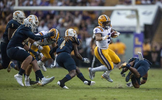 LSU junior running back Derrius Guice (5) runs the ball during LSU's 28-3 lead against Chattanooga at halftime at Tiger Stadium on Sept. 9, 2017.