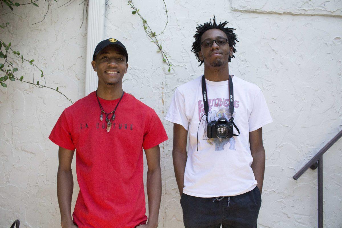 Keith Fort (left) and Bruce Williams (right) of Seaux La stand outside of Highland Coffees on Sept. 12, 2017.