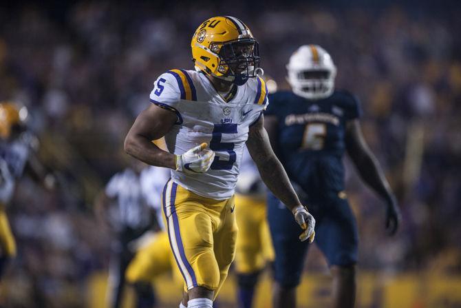 LSU junior running back Derrius Guice (5)celebrates during LSU's 45-10 win against Chattanooga on Saturday, Sept. 9, 2017, at Tiger Stadium.