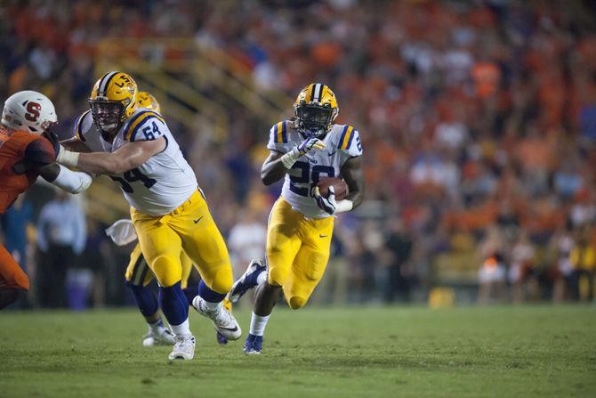 LSU senior running back Darrel Williams (28) runs the ball during the Tigers' 35-26 victory against Syracuse on Saturday, Sept. 23, 2017, in Tiger Stadium.