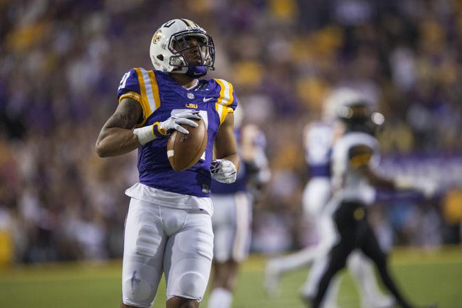 LSU junior cornerback Ed Paris (21) picks up the ball after after a uncertain fumble from the Eagles during the LSU 45-10 win against Southern Mississippi on Saturday Oct. 15, 2016, in Tiger Stadium.