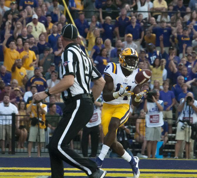 LSU sophomore wide receiver Drake Davis (14) catches the ball for a touchdown during the Tigers 45-10 victory over Chattanooga on Saturday, Sept. 9, 2017 in Tiger Stadium.