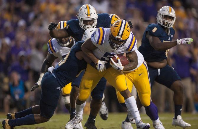 LSU junior running back Derrius Guice (5) runs the ball during LSU's 28-3 lead against Chattanooga at halftime at Tiger Stadium on Sept. 9, 2017.