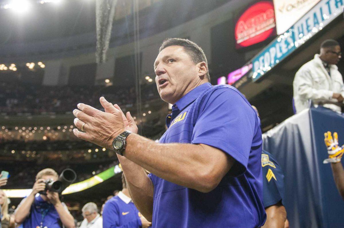 The LSU Tigers head football coach Ed Orgeron walks out of the tunnel for pre-game warmups before LSU's 27-0 win against BYU on Saturday, Sept. 2, 2017, at the Mercedes-Benz Superdome in New Orleans.