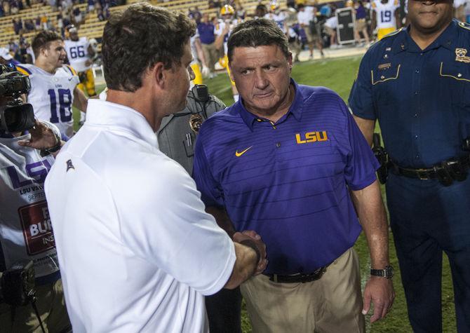 LSU head coach Ed Orgeron shakes hands with Chattanooga head coach Tom Arth after the Tigers 45-10 victory over Chattanooga on Saturday, Sept. 9, 2017 in Tiger Stadium.