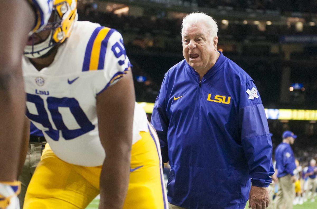 LSU defensive line coach Pete Jenkins directs his players during pre-game warmups before LSU's 27-0 win against BYU on Saturday, Sept. 2, 2017, at the Mercedes-Benz Superdome in New Orleans.