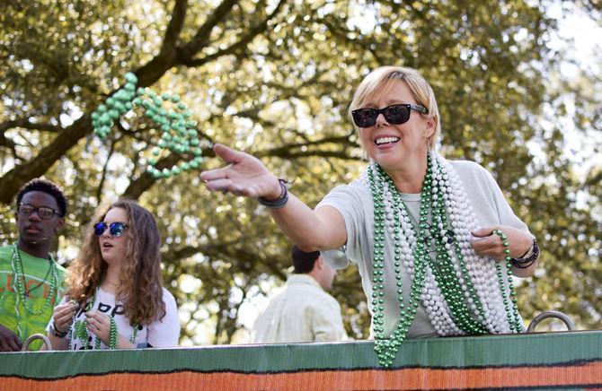 A float rider throws beads to the crowd at the St. Patrick's Day Parade on Saturday, March 18, 2017 in Baton Rouge.