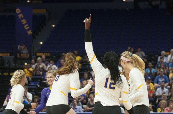 The team celebrates a point during the Lady Tigers' 3-0 win over the University of Houston on Saturday, Sept. 15, 2017, at the Pete Maravich Assembly Center.