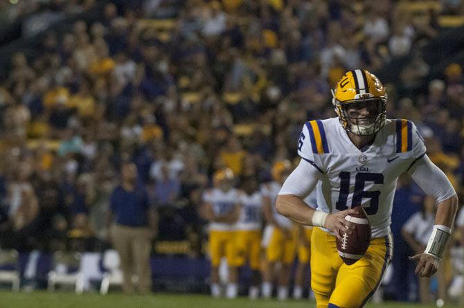 LSU senior quarterback Danny Etling (16) runs down the field with the ball during the Tigers 45-10 victory over Chattanooga on Saturday, Sept. 9, 2017 in Tiger Stadium.