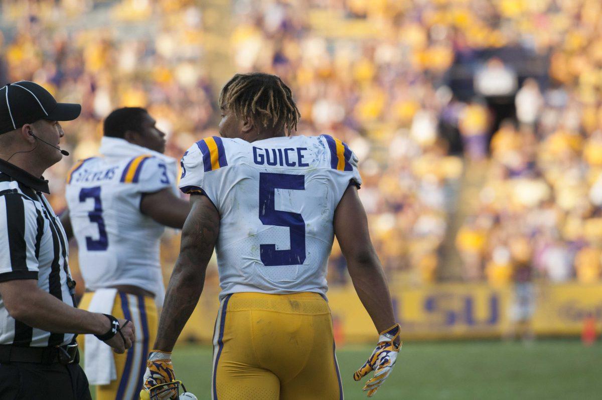 LSU junior running back Derrius Guice (5) looks at a referee during the LSU Tigers' 27-23 victory against Auburn on Saturday, Oct. 14, 2017 in Tiger Stadium.