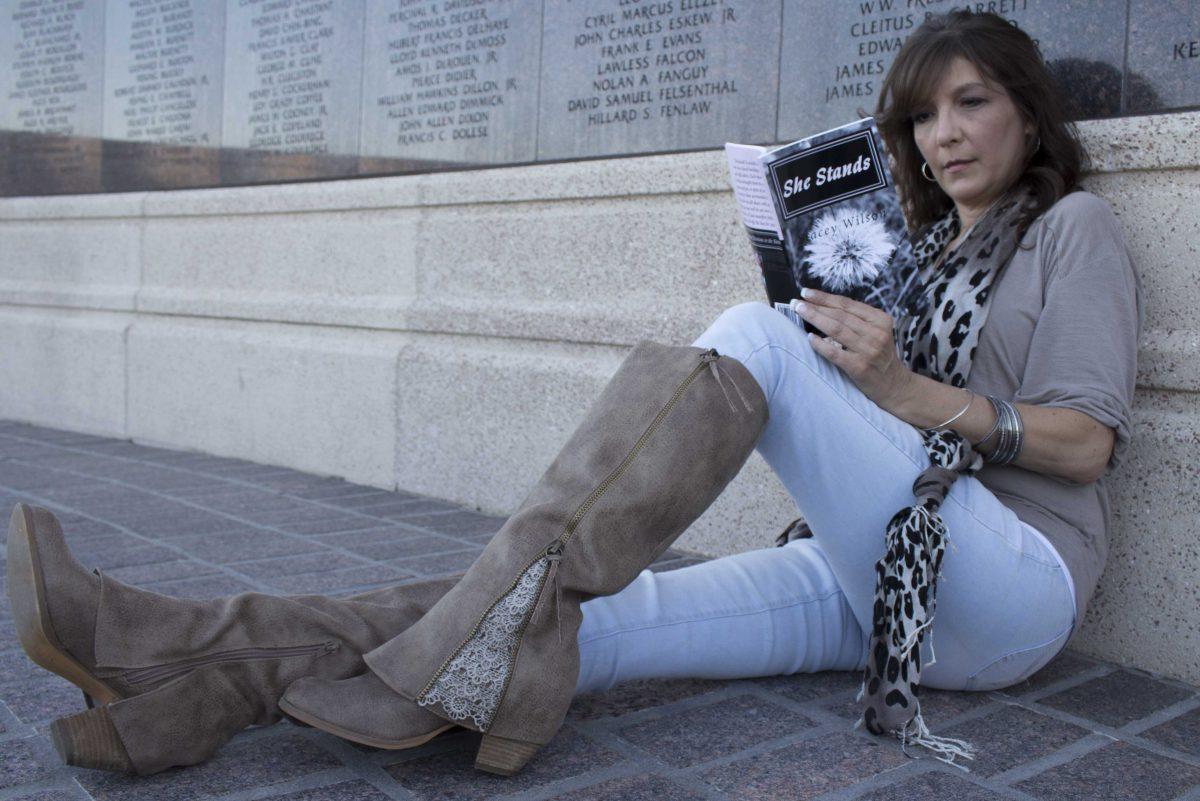 Author Stacey Wilson reads her book "She Stands," on the University's Parade Grounds on Oct. 17, 2017.