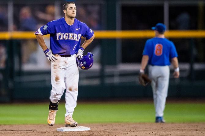 LSU freshman infielder Josh Smith (4) begins to walk to the Tigers' dugot after Florida nails a third out during the Tigers' 4-3 loss against the Gators on Monday June 26, 2017, at TD Ameritrade Park in Omaha, Nebraska.