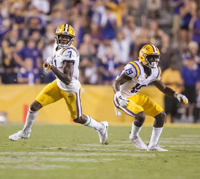 LSU senior wide receiver DJ Chark (7) runs the ball down the field during the Tigers' 35-26 win against Syracuse on Saturday, Sept. 23, 2017, in Tiger Stadium.