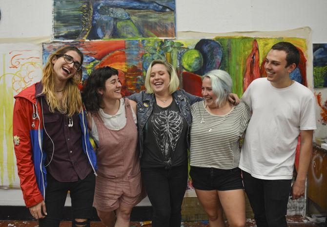 Members of the Painter's League stand in Foster Hall on Monday, Sept. 2, 2017.