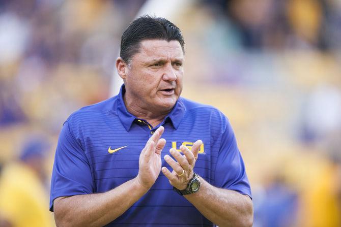 LSU football coach Ed Orgeron cheers on his team during the Tigers' 35-26 win against Syracuse on Saturday, Sept. 23, 2017, in Tiger Stadium.