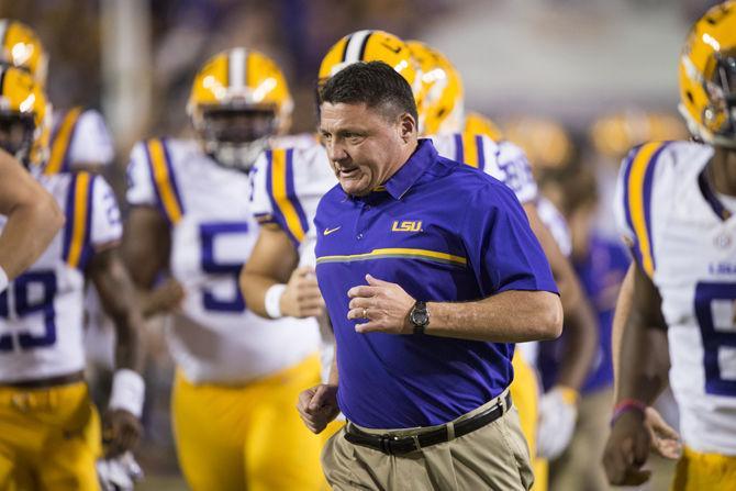 LSU interim head football coach Ed Orgeron leads the Tigers onto the field before the game against Alabama on Saturday Nov. 5, 2016, in Tiger Stadium.