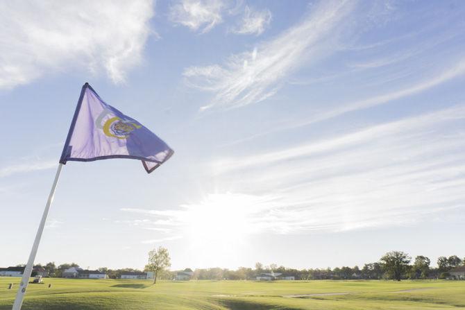 A University Club flag waves prior to the second day of the David Toms Intercollegiate tournament on Oct. 9, 2016 at the University Club golf course.