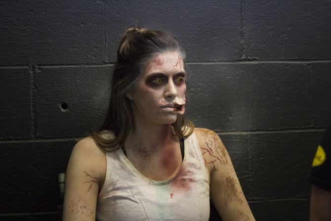 A female cast member gets special effects makeup applied on Friday, Oct. 13, 2017 at the 13th Gate near downtown Baton Rouge.