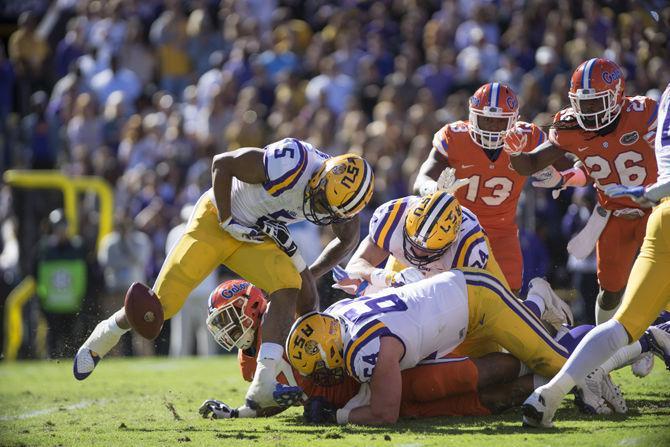 LSU sophomore running back Derrius Guice (5) fumbles the ball early on during the Tigers' 16-10 loss to the Florida Gators on Saturday Nov. 19, 2016 at Tiger Stadium.