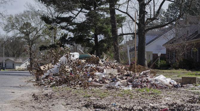 Debris sits on the lawn of a Sherwood Forest home on Saturday, Feb. 11, 2017, on Woodcliff Drive in Baton Rouge, Louisiana.