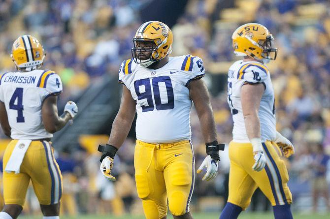 LSU sophomore defensive end Rashard Lawrence (90) walks onto the field during the Tigers' 35-26 win against Syracuse on Saturday, Sept. 23, 2017.