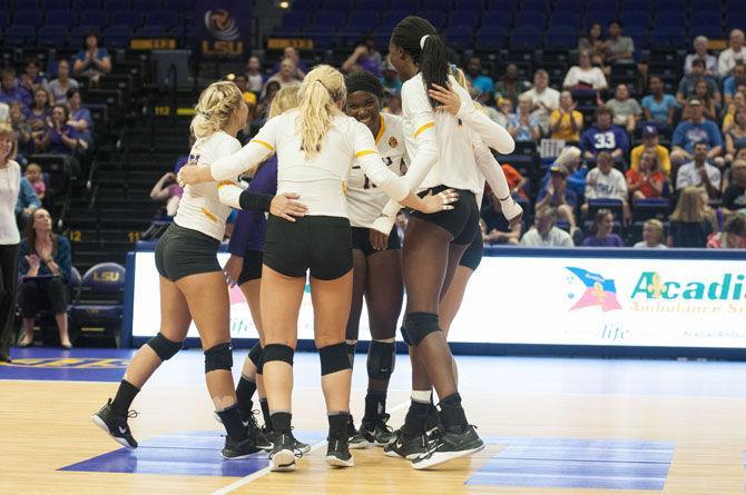 The team celebrates a point during the Lady Tigers' 3-0 win over the University of Houston on Saturday, Sept. 15, 2017, at the Pete Maravich Assembly Center.