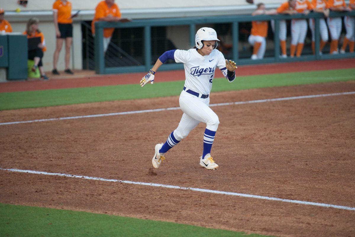 LSU senior catcher and infielder Sahvanna Jaquish (2) runs to first base during the Tigers&#8217; 6-3 loss to Tennessee on Friday, April 21 2017, at Tiger Park.