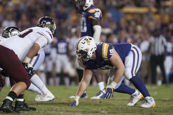 LSU senior defensive end Christian LaCouture (18) prepares for a play against the Trojans during the Tigers' 24-21 loss against Troy in Tiger Stadium on Saturday, Sept. 30, 2017.