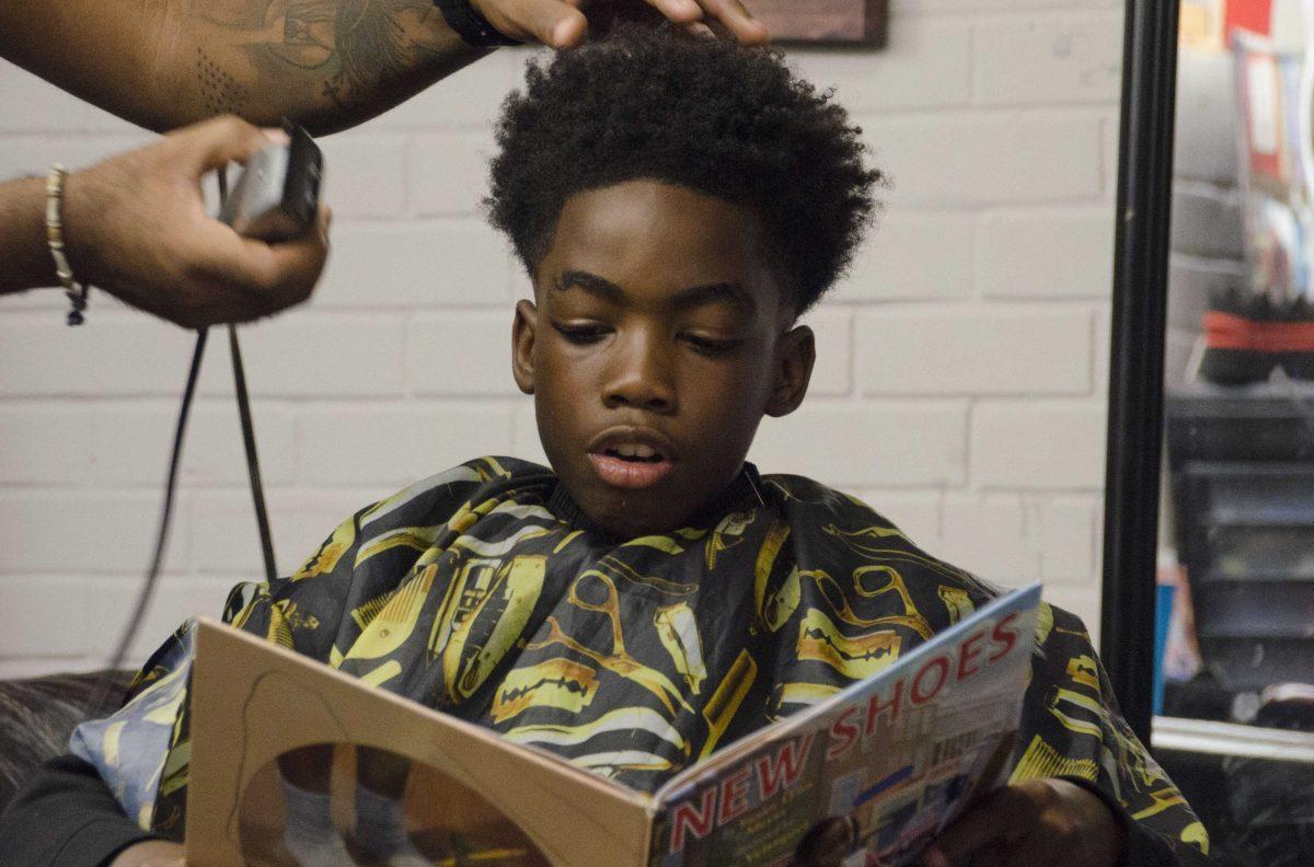 The Museum of Art outreach program, Line 4 Line, lets Jeremiah read a book in exchange for a free haircut on Monday, Oct. 02, 2017 at O'Neal's Barber Shop on Acadian Thruway.