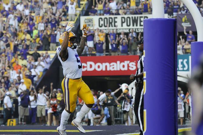 LSU junior running back Derrius Guice (5) celebrates a touchdown during the Tigers' 35-26 victory against Syracuse on Saturday, Sept. 23, 2017, in Tiger Stadium.