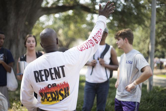 Members of the Consuming Fire Fellowship elicit a student response on Sept. 27, 2016 in Free Speech Plaza near the LSU Student Union.