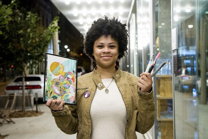 Artist Raven "Bird Burger" Jones speaks on behalf of her artwork outside of Magpie Cafe on Laurel St. on Monday, Oct. 16, 2017.