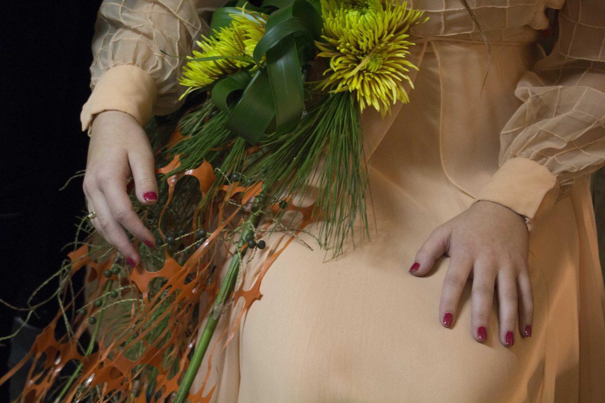 Dietetics freshman Morgan Mayeux waits before the show, Couture de la Fleur, where fashion meets flora, hosted by the LSU College of Agriculture and Mendel University of the Czech Republic at the LSU AgCenter Botanic Gardens on Oct. 11, 2017.