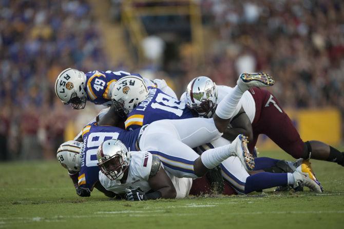 LSU football players take on Troy during the trojan's 10-0 lead against the tigers at half-time on Saturday, Sept. 30, 2017, in Tiger Stadium.