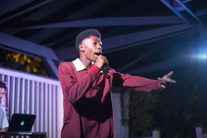 Josh Henderson (_thesmoothcat) pumps up the crowd with his opening set during the KLSU College Radio Day celebration on Friday Nov. 4, 2016 at Barcadia on Highland Road just off of campus.