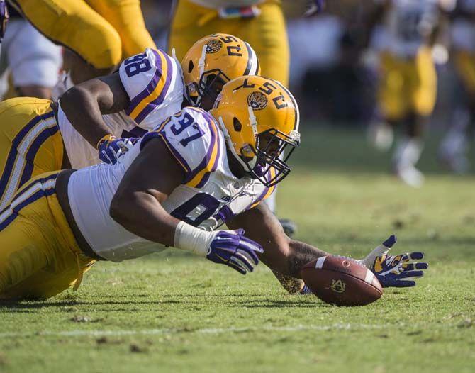 <p>LSU sophomore defensive tackle Frank Herron (97) recovers a ball dropped by Auburn quarterback Jeremy Johnson (6) during the Tigers' 45-21 victory against Auburn on Saturday, Sept.19, 2015, in Tiger Stadium.</p>